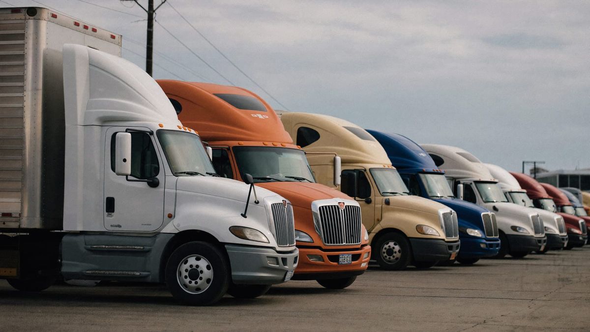A line of tractor-trailers at a Chicago-area terminal on a grey morning