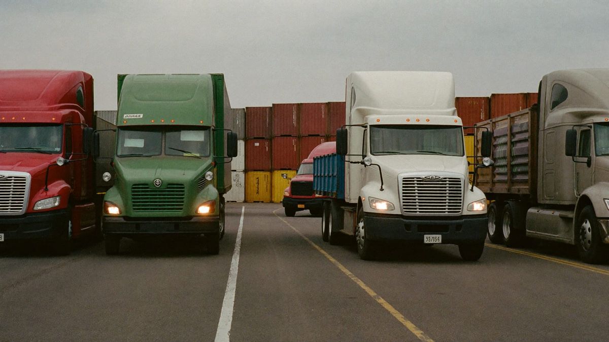 Tractor-trailers and stacked containers at a Chicago-area intermodal rail yard